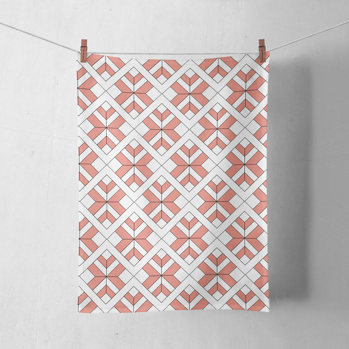 Shadowbright Coral and White Tea Towel with a Geometric Design