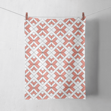 Shadowbright Coral and White Tea Towel with a Geometric Design