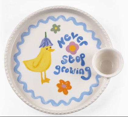 Eleanor Bowmer Never Stop Growing duck egg-cup plate with floral motif