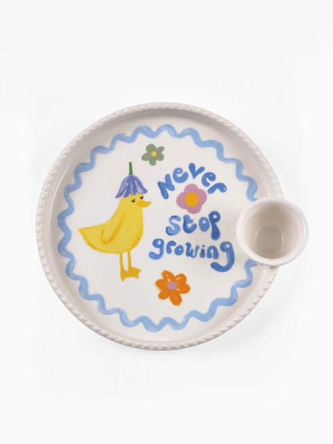 Eleanor Bowmer Never Stop Growing duck egg-cup plate with floral motif