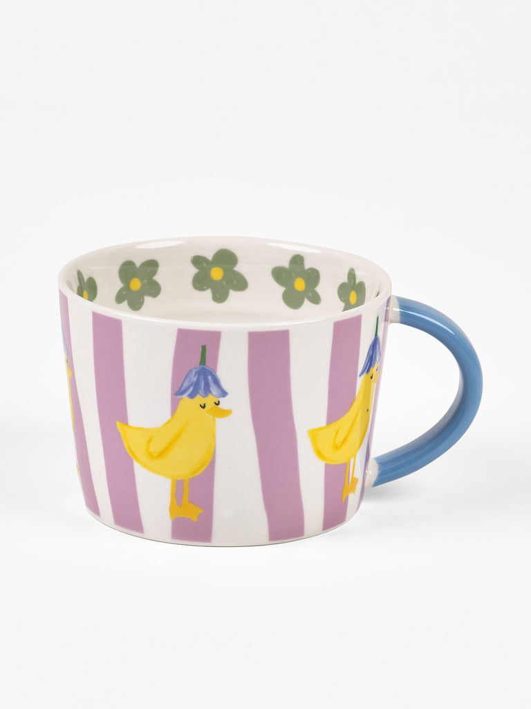 Close-up of duckling illustration on Never Stop Growing mug