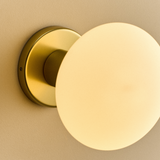 Tala Lochan Wall Light in Brass Oval Dim to Warm