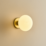 Tala Lochan Wall Light in Brass Oval Dim to Warm