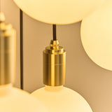 Tala Triple Pendant Light in Brass with Sphere IV Bulbs